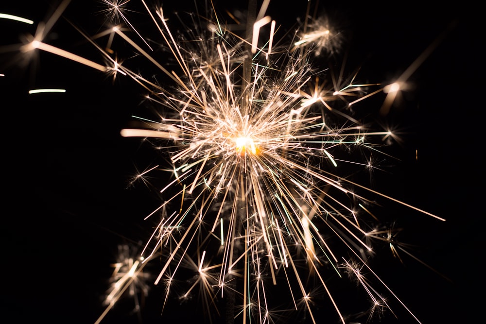 a close up of a fireworks on a black background