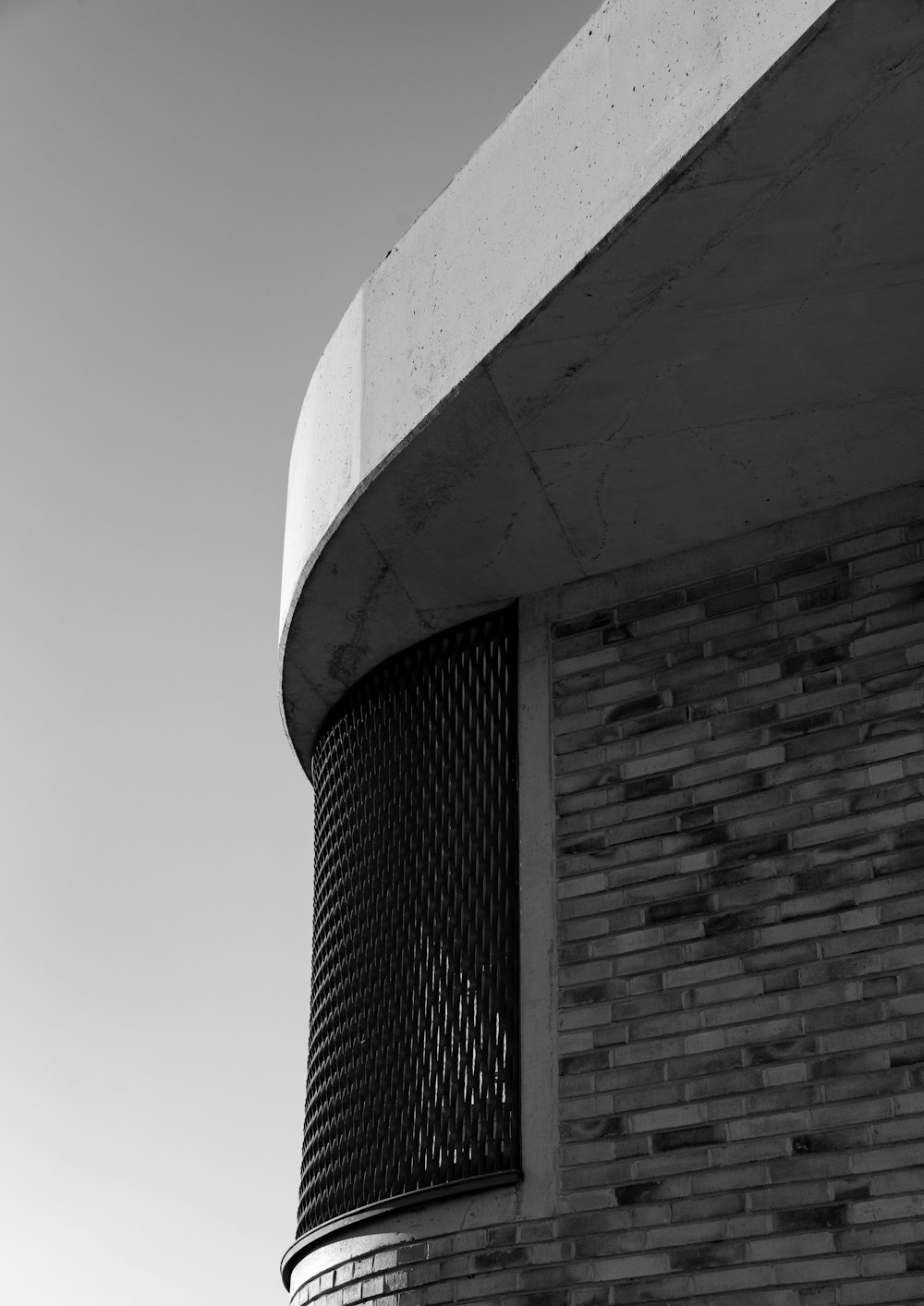 a black and white photo of a brick building