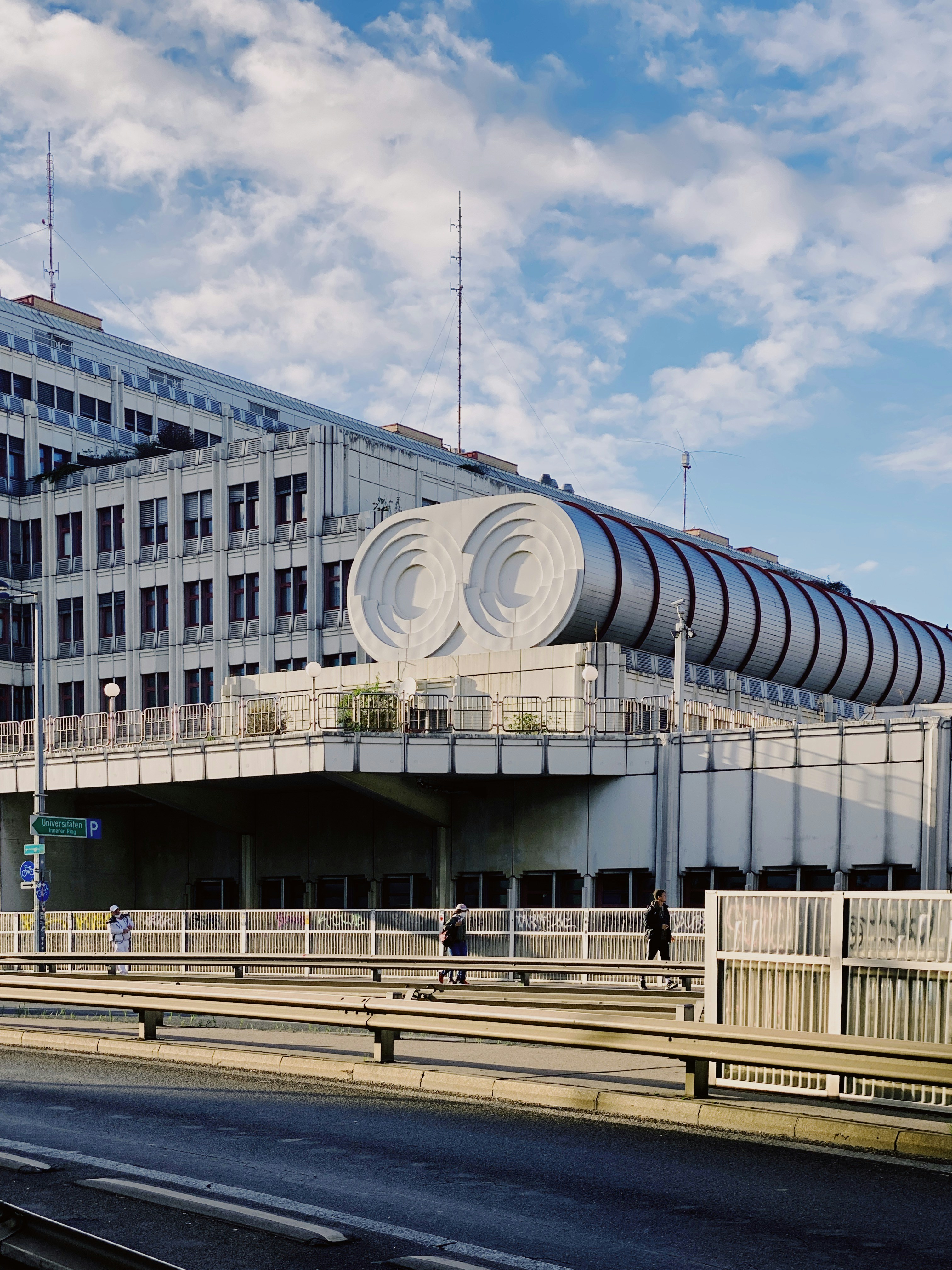A large building with a circular design on top of it photo – Free ...