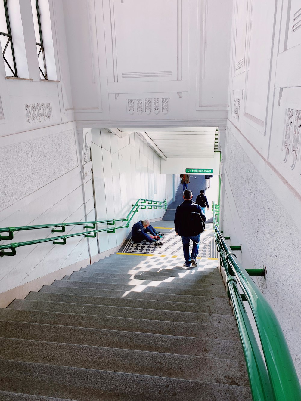 two people walking up a flight of stairs