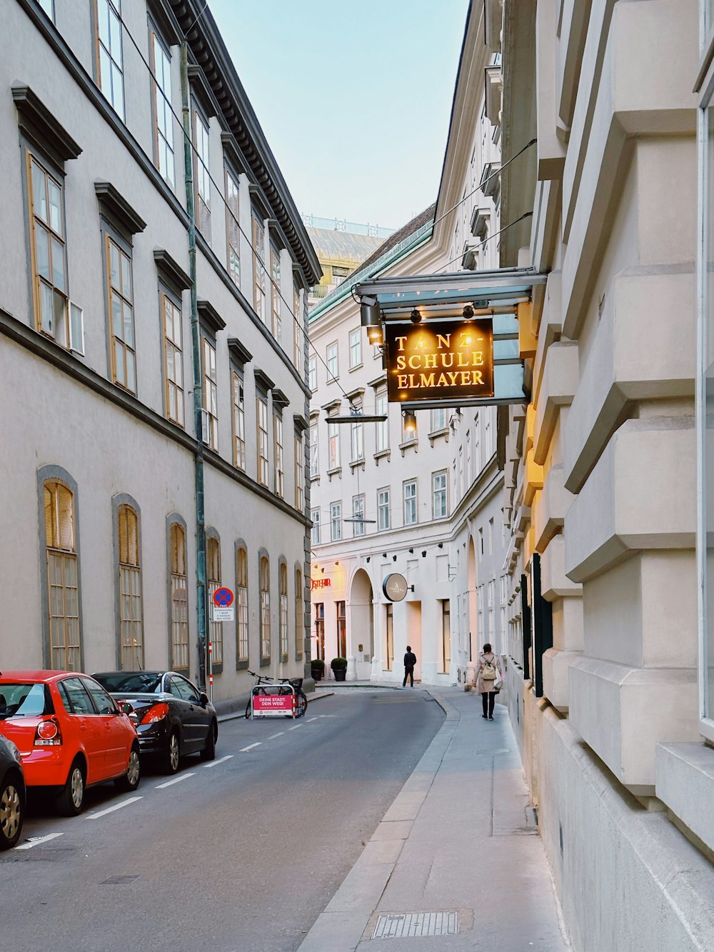 a street with cars parked on both sides of it