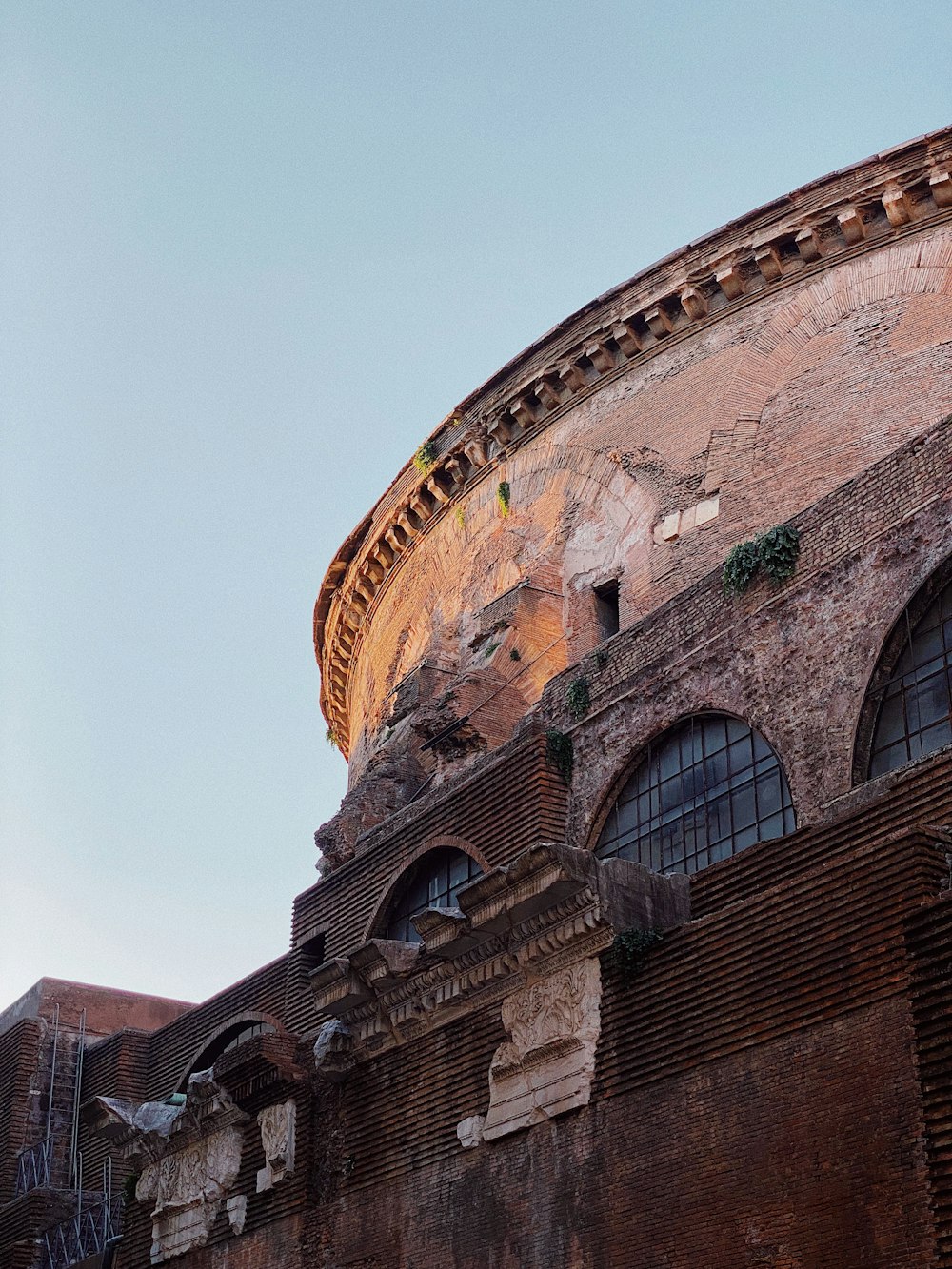 an old building with a clock on the side of it