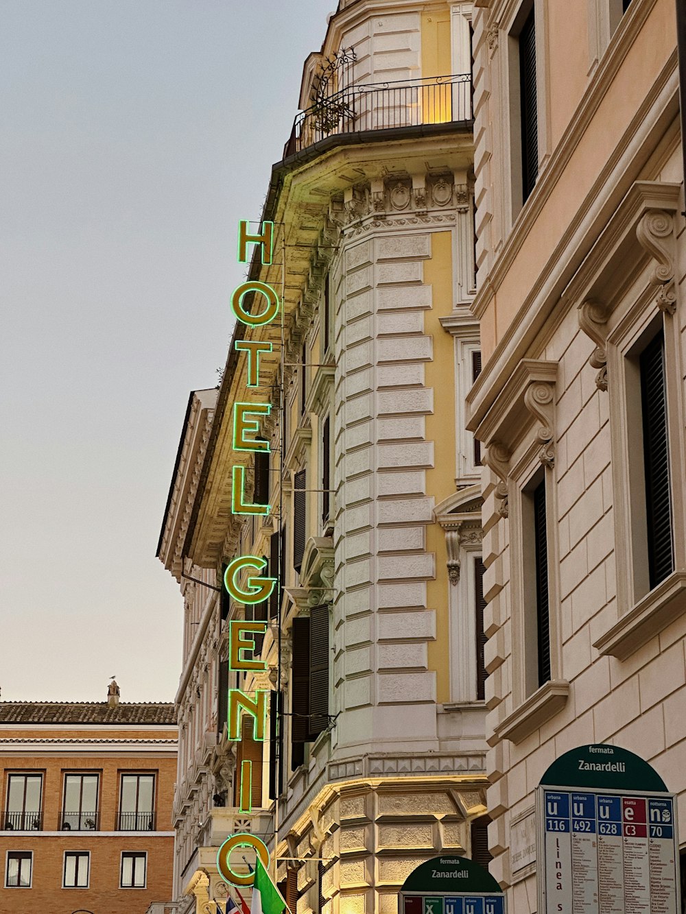 a building with a neon sign on the side of it