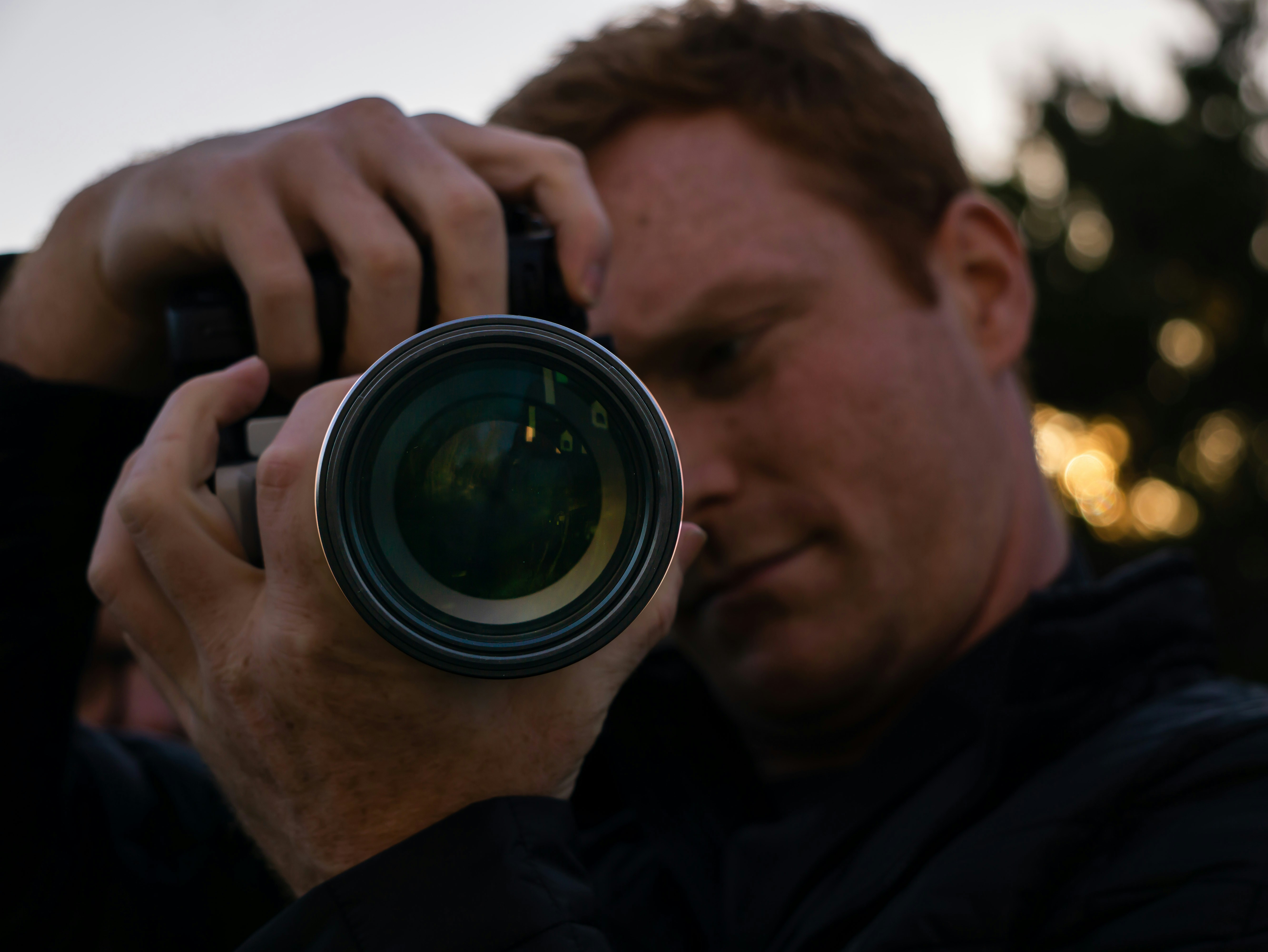 a man taking a picture with a camera