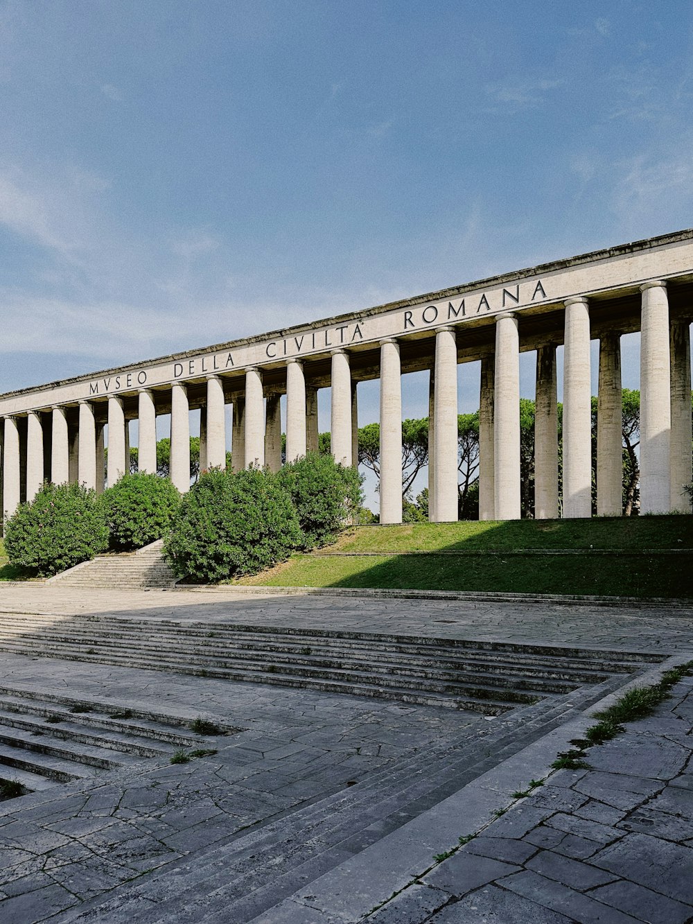 a large building with columns and steps leading up to it