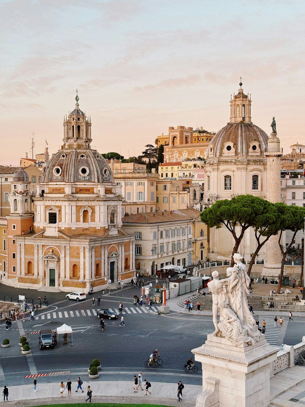 a city square with a statue in the middle of it