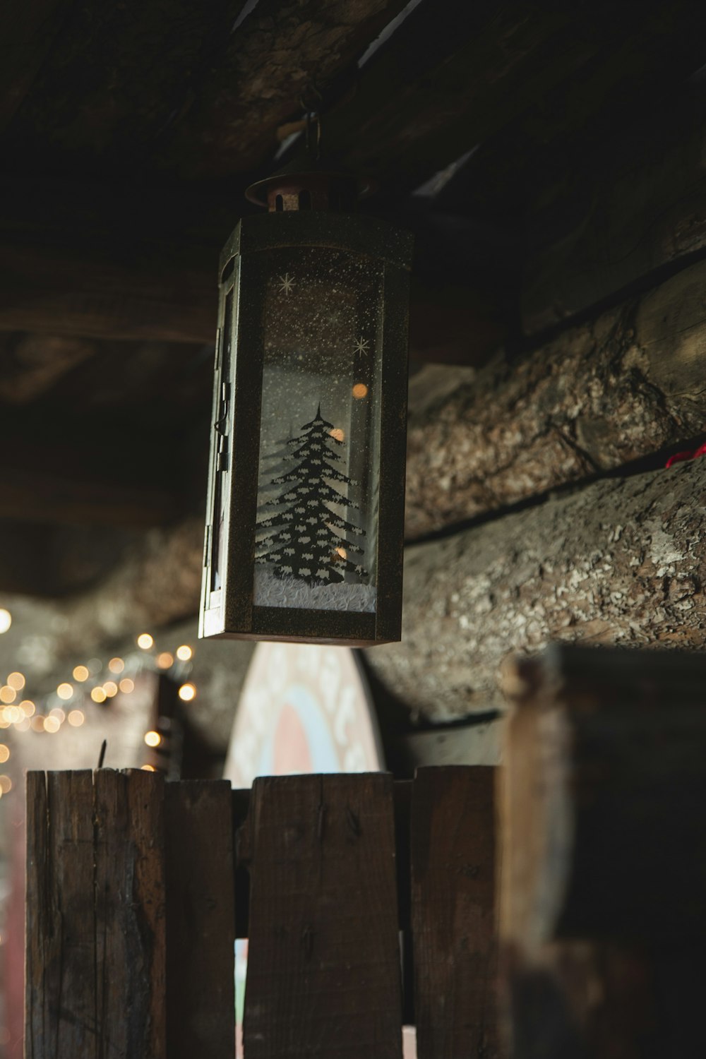 a lantern hanging from the ceiling of a cabin