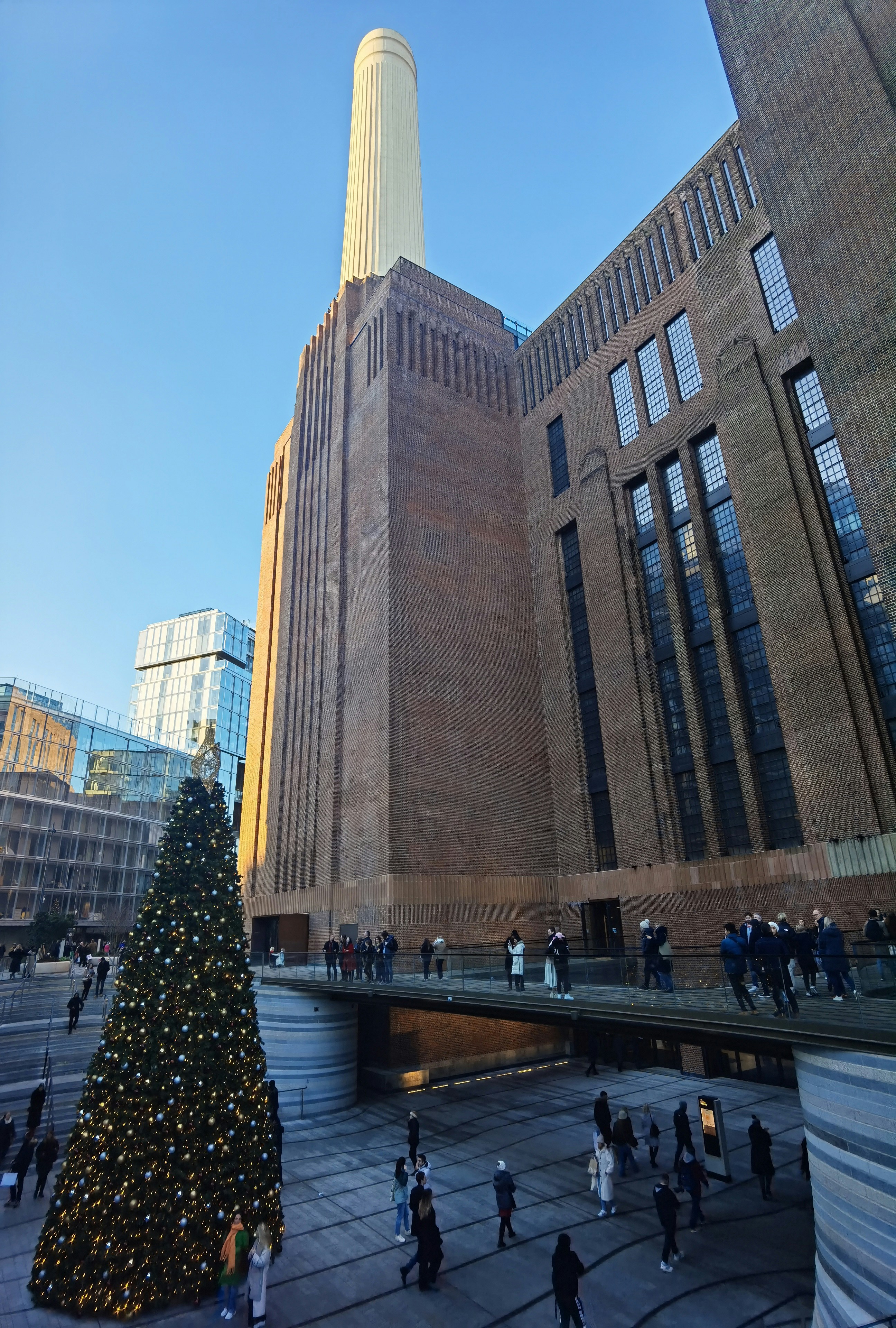 a large building with a christmas tree in front of it