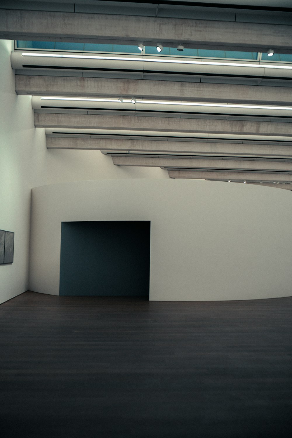 an empty room with a black square in the center