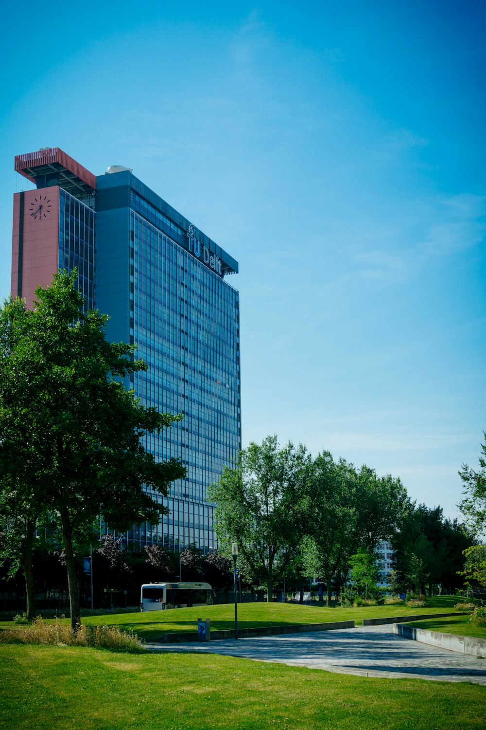 a very tall building sitting in the middle of a park