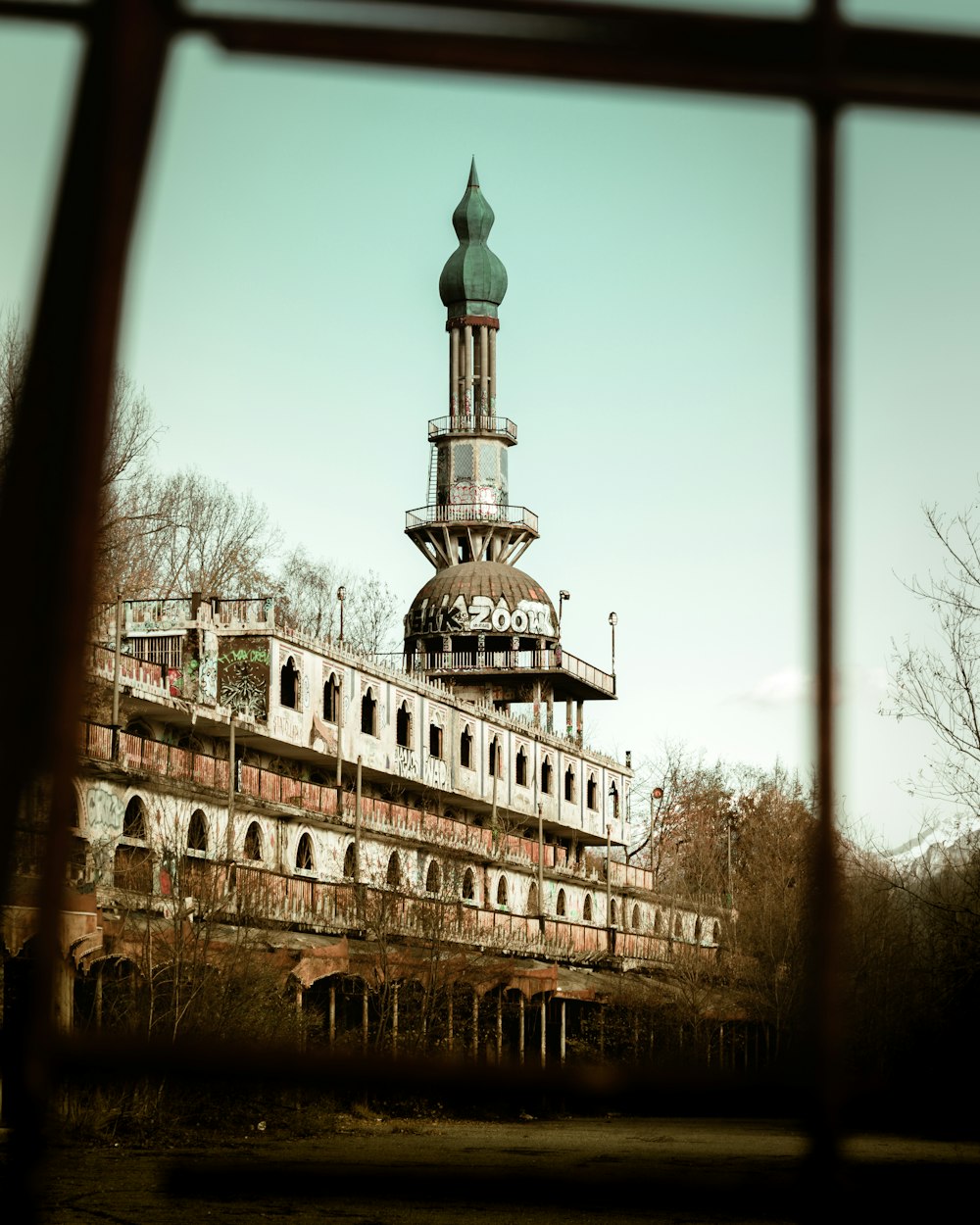 an old building with a tower in the middle of it