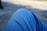 A close-up of a person wearing stylish denim jeans in a casual setting.