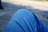 A close-up of a person wearing stylish denim jeans in a casual setting.