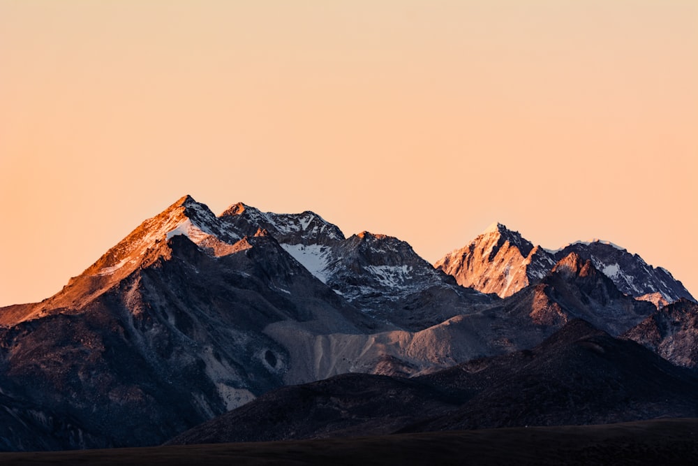 a view of a mountain range at sunset