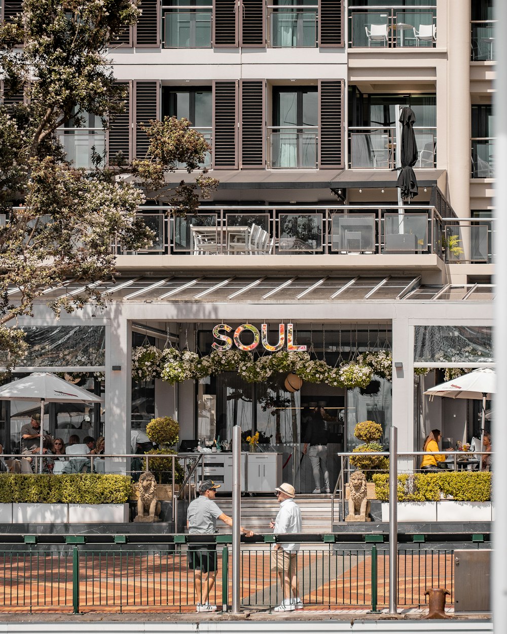 a couple of people that are standing in front of a building