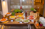 A vibrant spread of fresh salads and grilled vegetables arranged elegantly on a corporate event buffet table.
