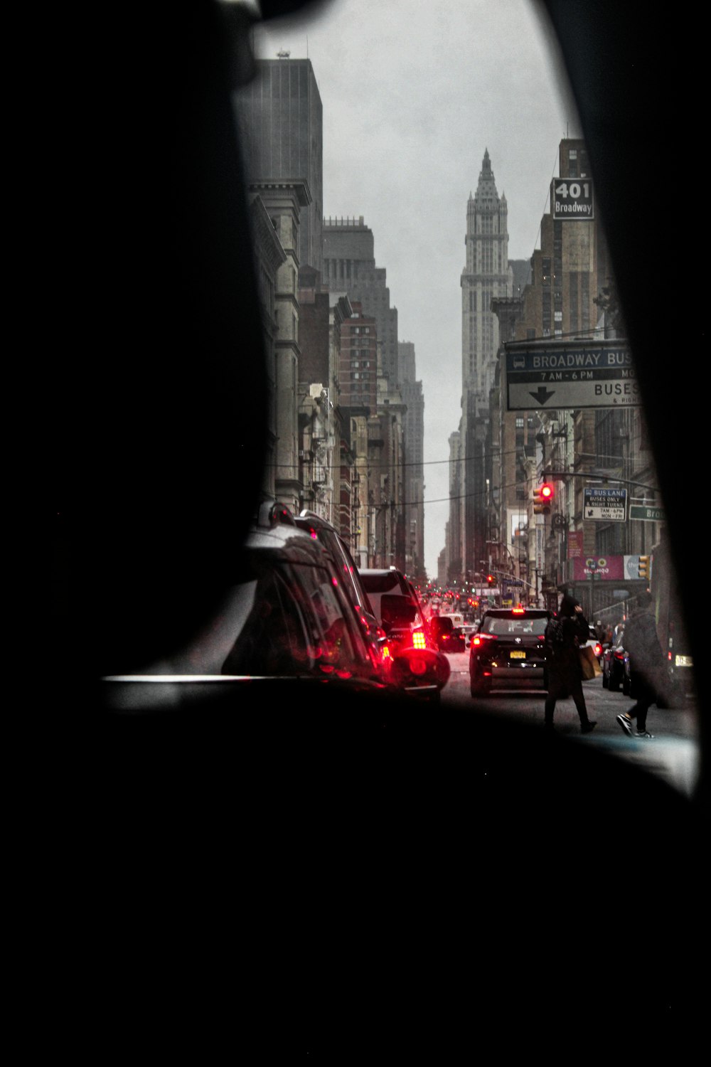 a city street filled with traffic and tall buildings