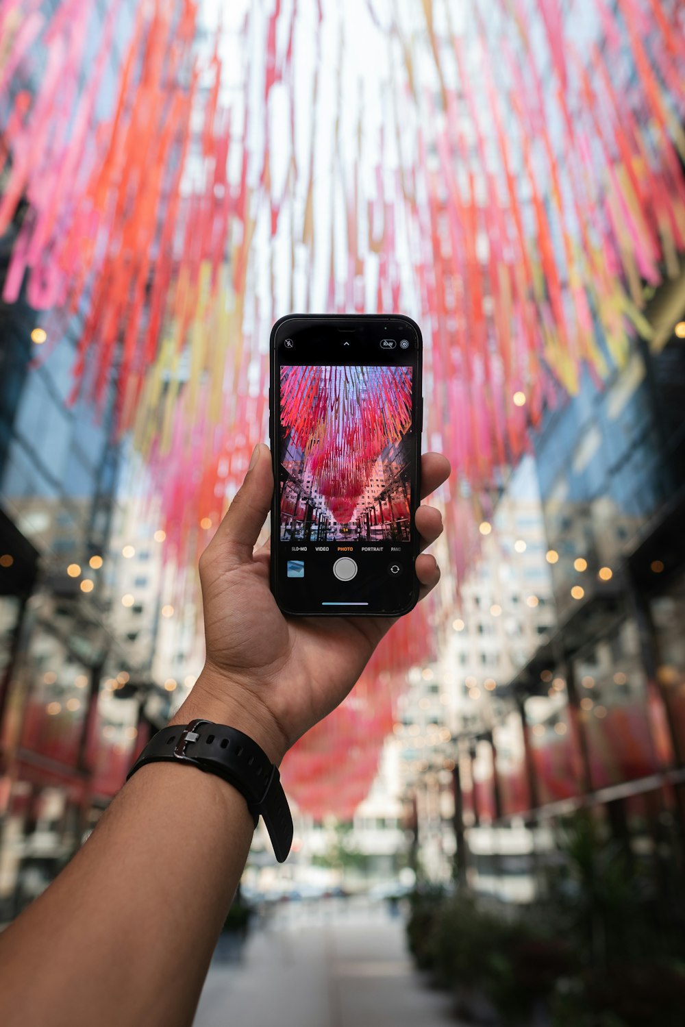 a person holding a cell phone in their hand