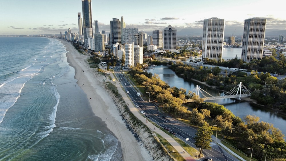 an aerial view of a city next to the ocean