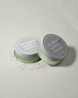 two jars of no sebum mineral powder on a white surface