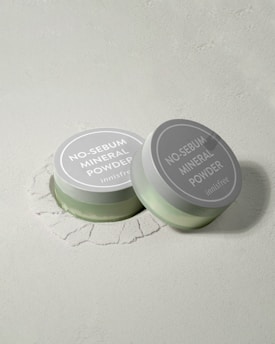 two jars of no sebum mineral powder on a white surface