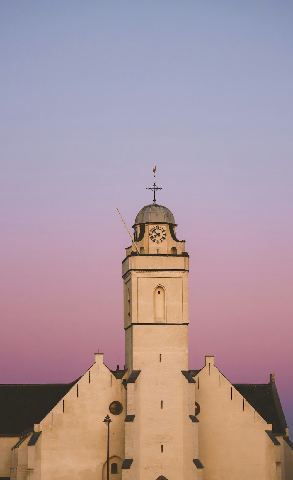 a large building with a clock on the top of it