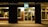 A modern storefront illuminated at night, showcasing a stylish sign.