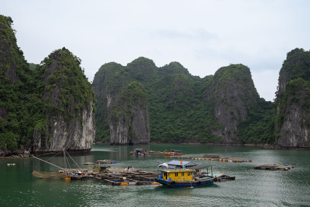 a group of boats floating on top of a lake