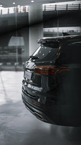 Sleek black SUV with freshly tinted windows parked under soft natural light.