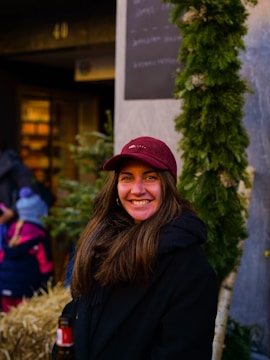 Smiling faces of people receiving warm clothing during a winter outreach.