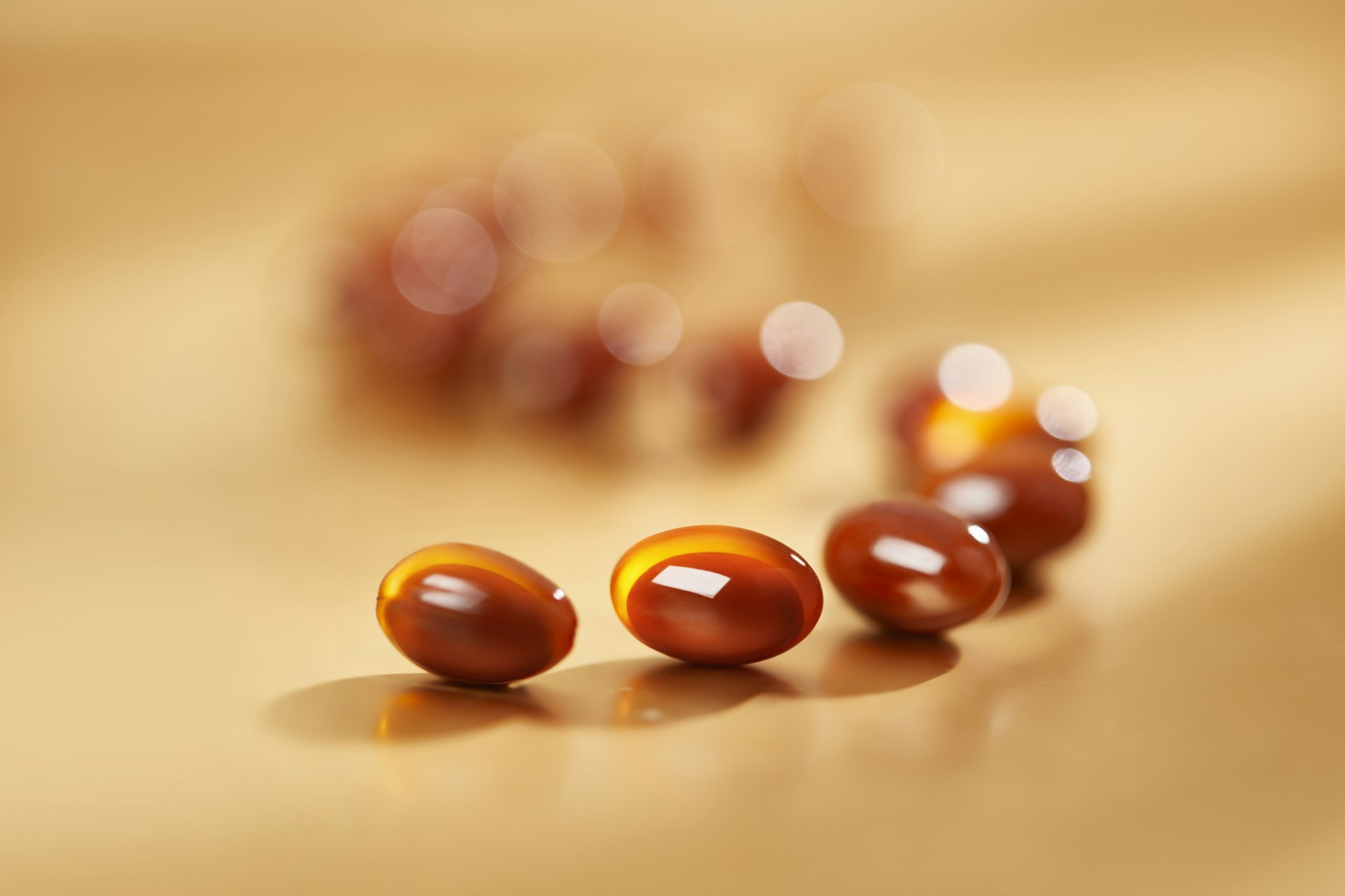 a close up of a group of pills on a table
