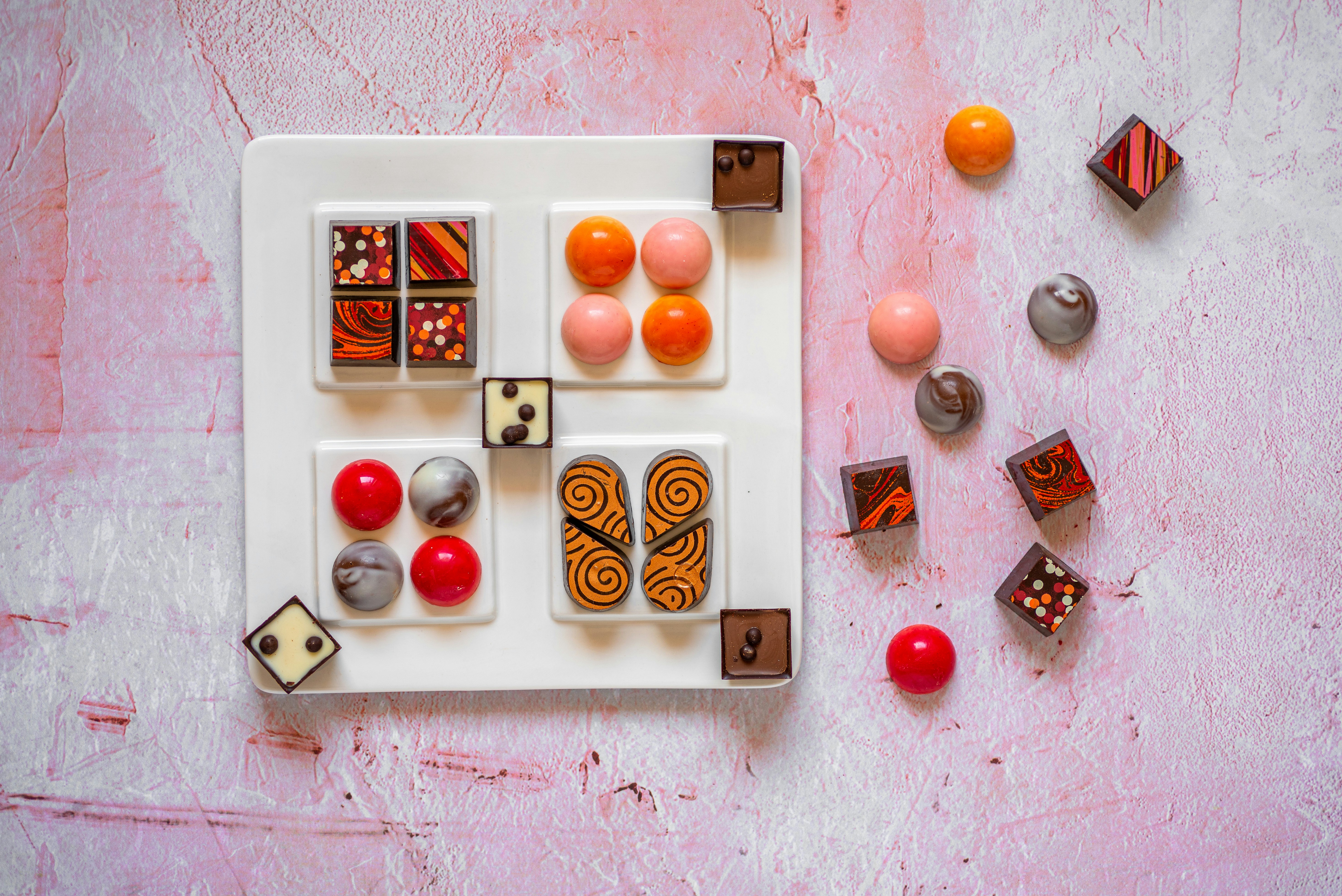 a white plate topped with different types of candies