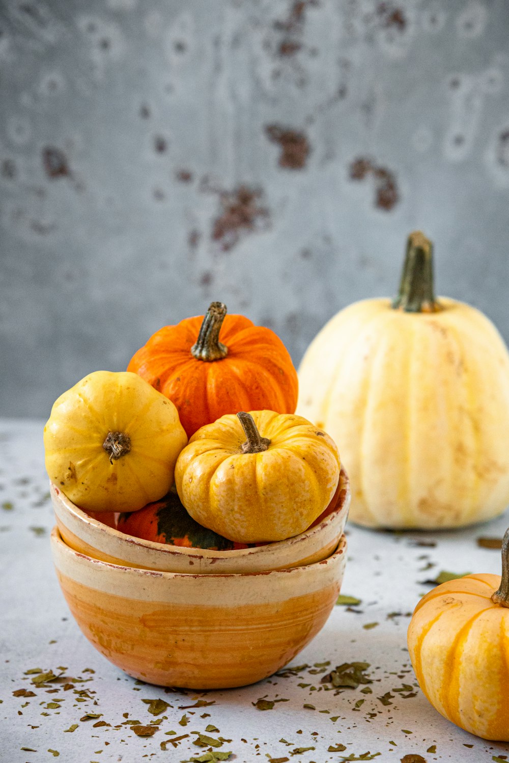 a group of pumpkins sitting on top of a table