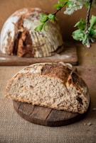 Sliced rustic country bread revealing a soft, airy crumb texture