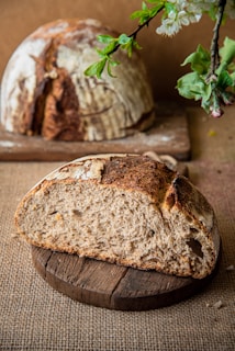 Sliced rustic country bread revealing a soft, airy crumb texture