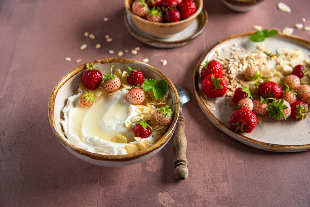 a table topped with three bowls of food