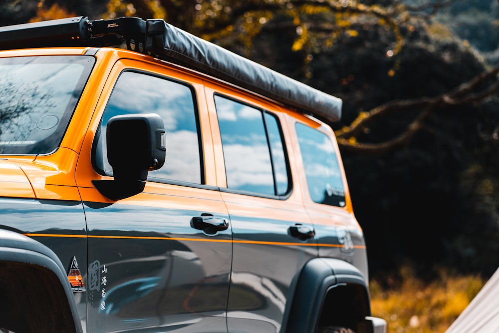 a close up of a yellow and black jeep