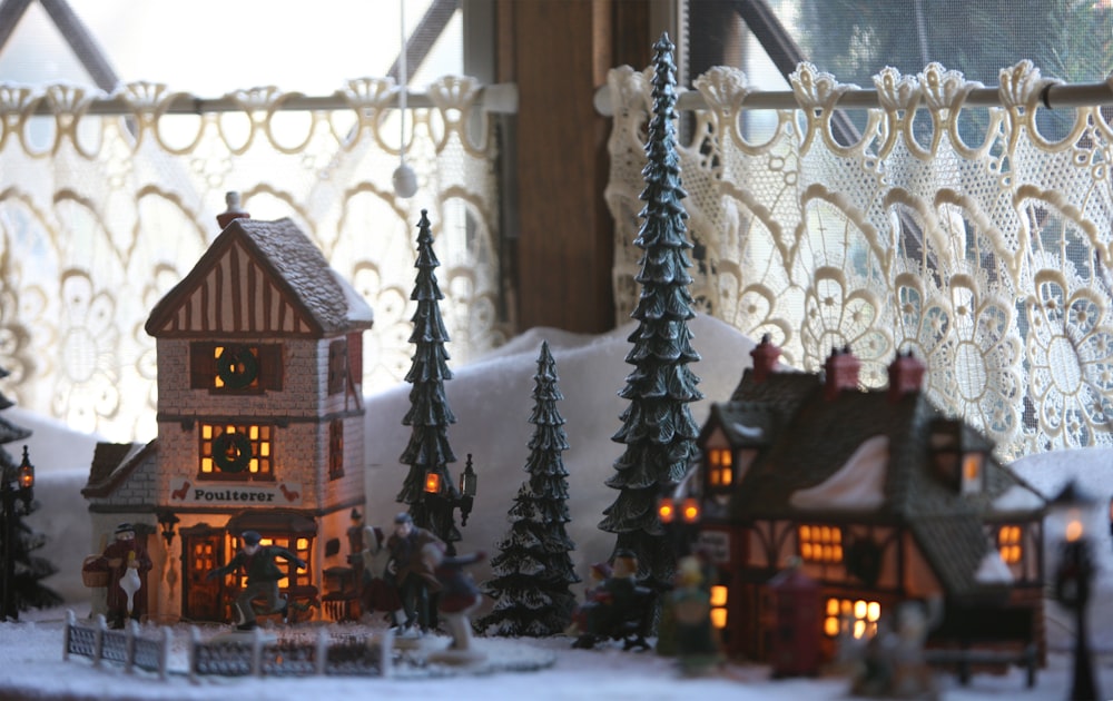 a group of miniature houses sitting on top of a table