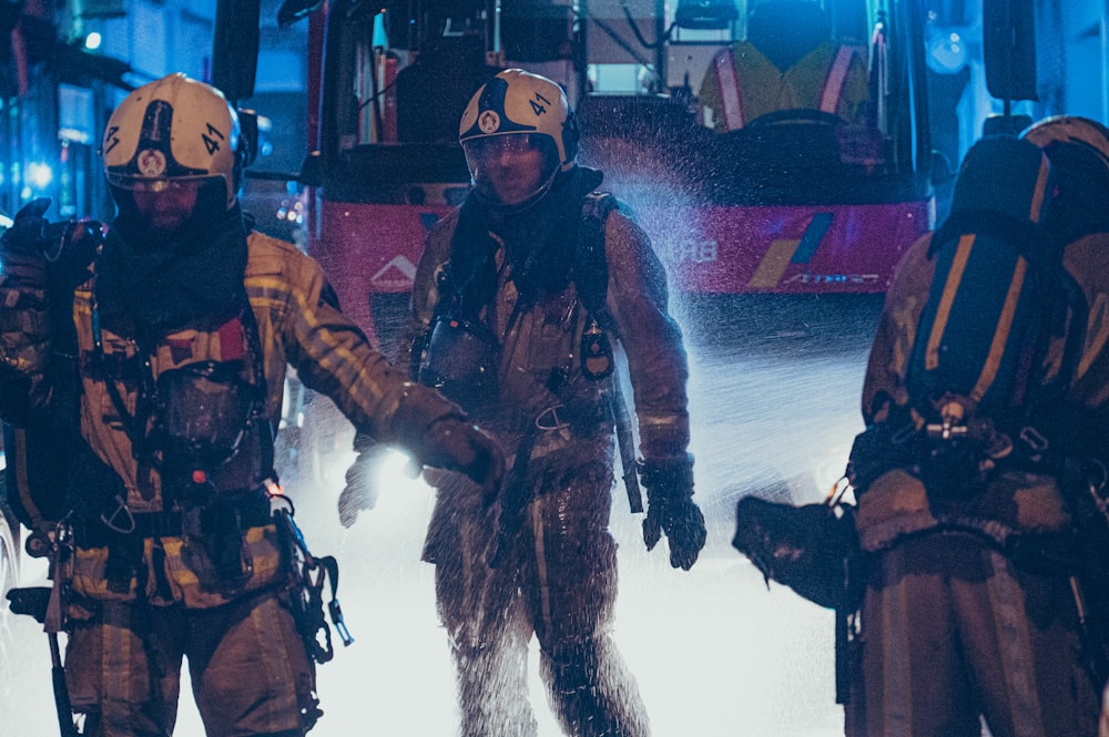 a group of firefighters standing next to each other