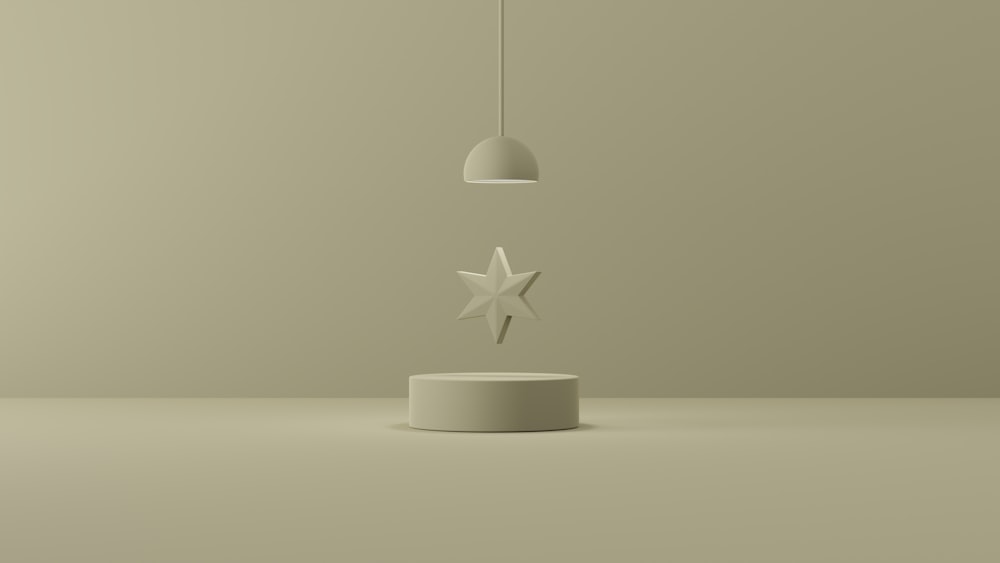 a white object with a star hanging off of it's side