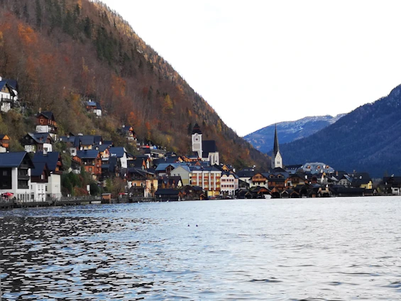 A serene Swiss village backdrop with minimalist Bauhaus-inspired geometric shapes subtly integrated into the landscape.