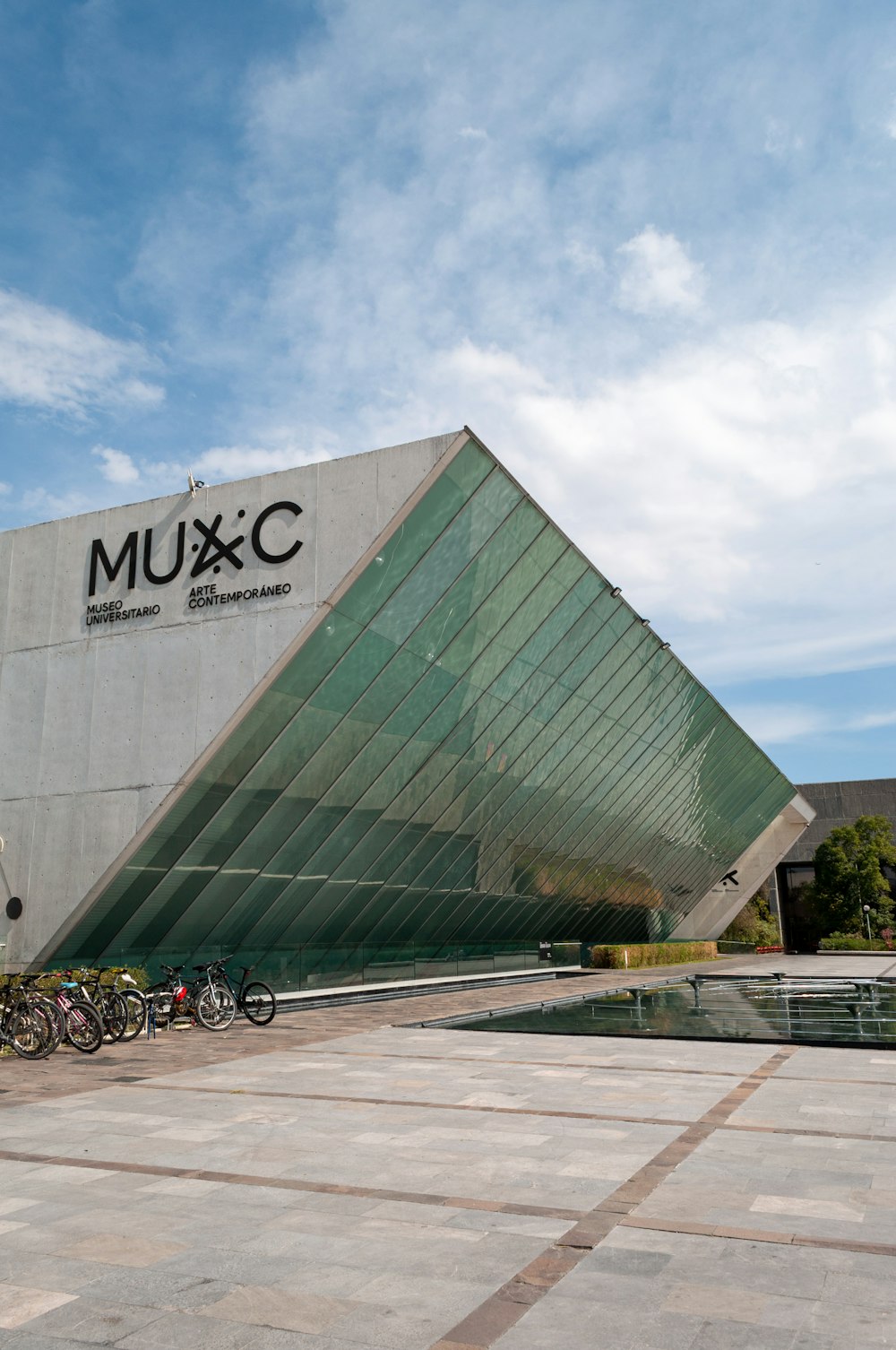 a group of bikes parked in front of a building