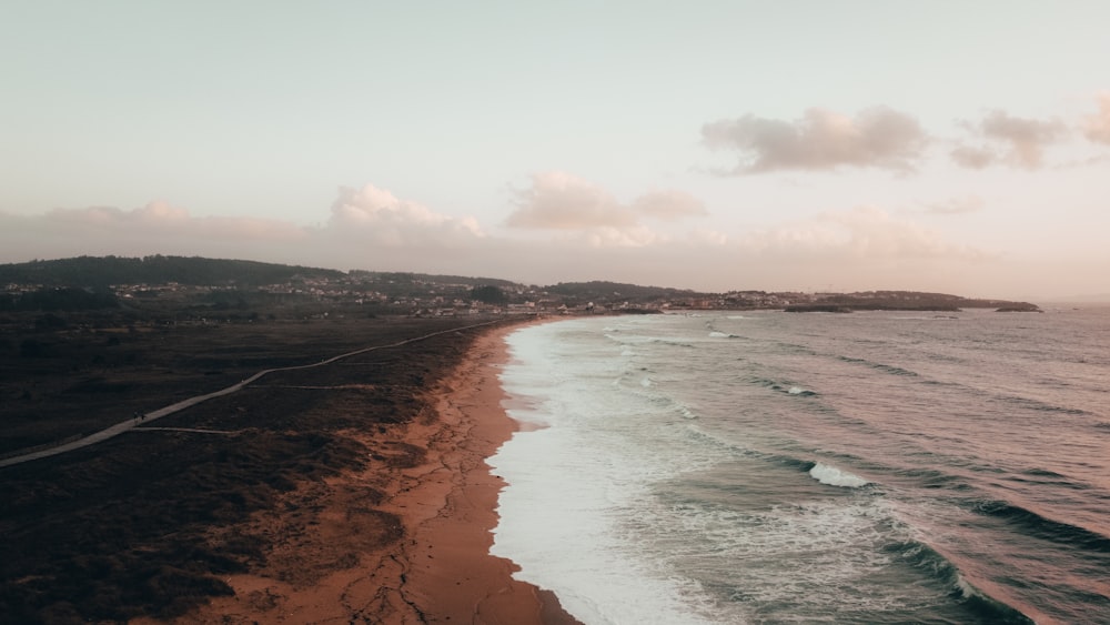 an aerial view of a beach and ocean