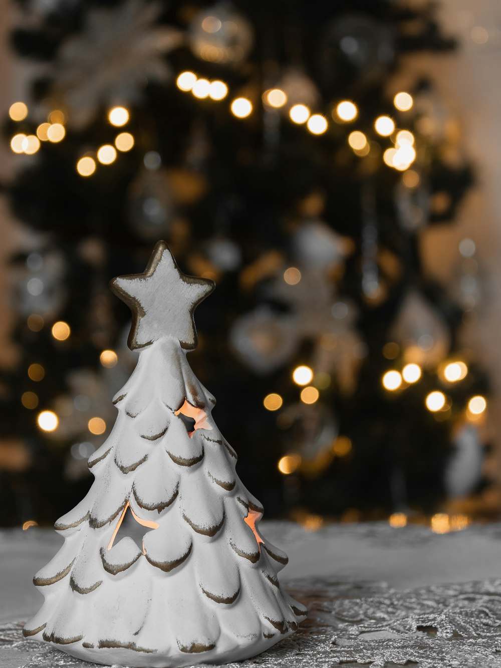 a small white christmas tree on a table