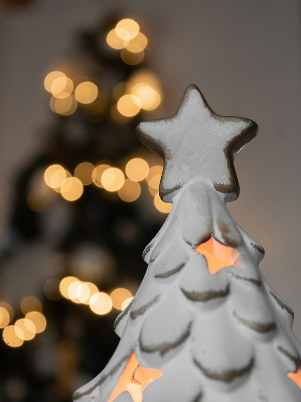 a lit up christmas tree with a star on top