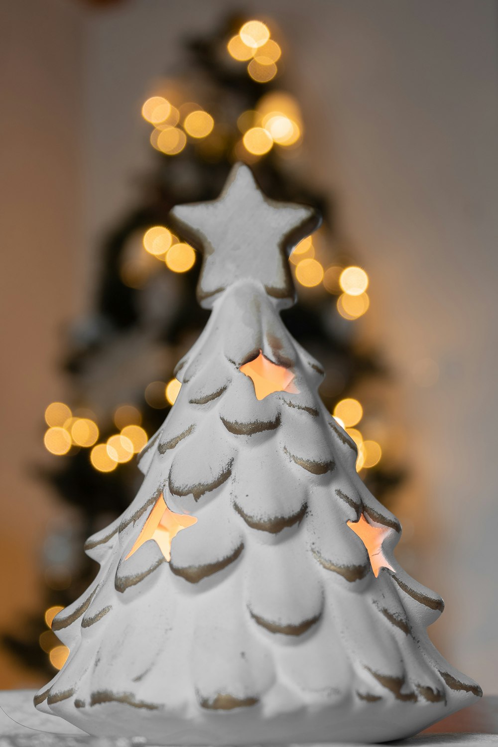 a white ceramic christmas tree on a table