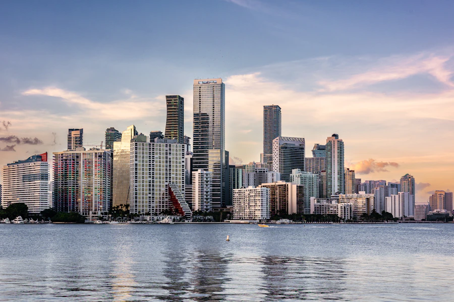 The Miami skyline seen across Biscayne Bay with sailboats moored in the foreground