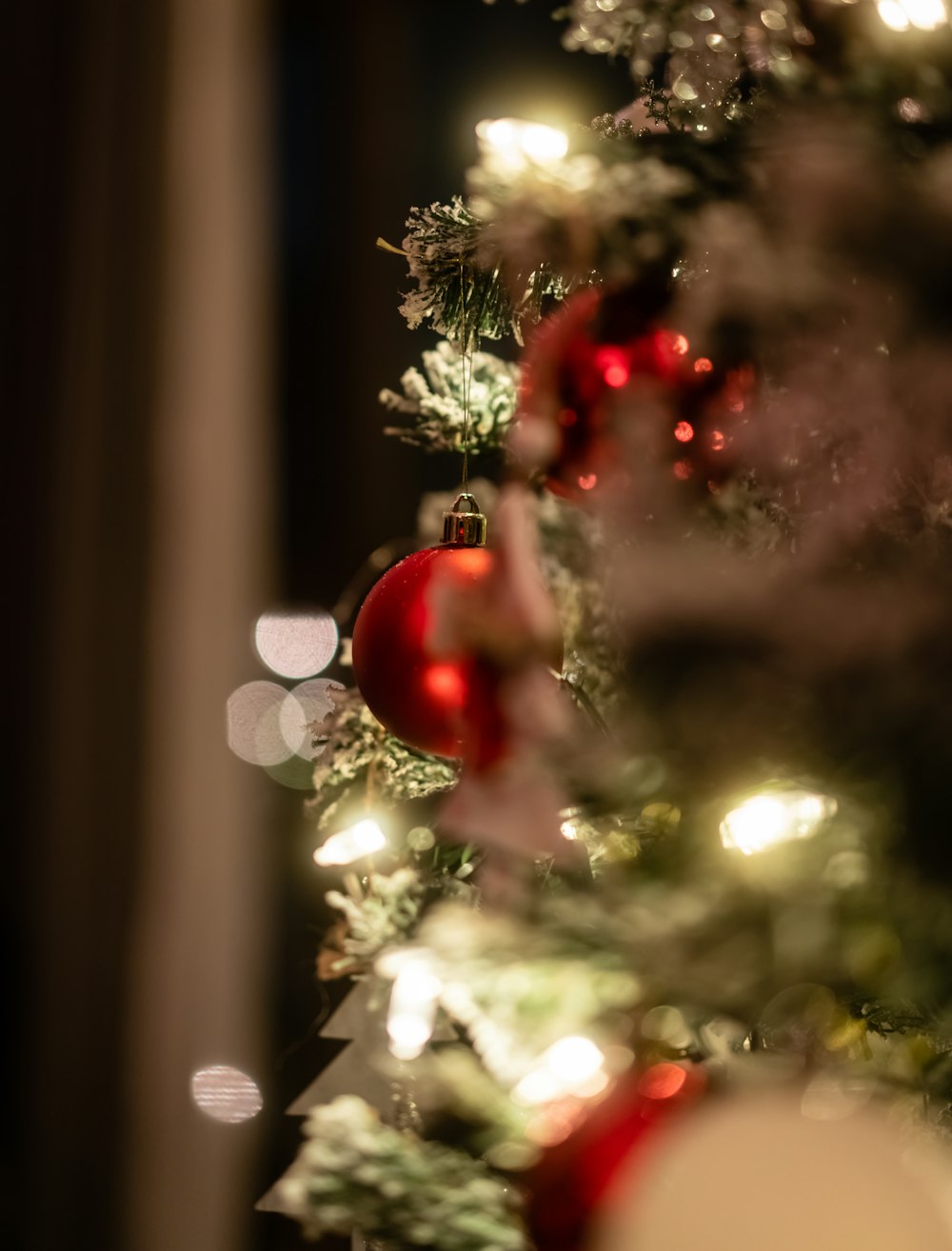 a close up of a christmas tree with ornaments