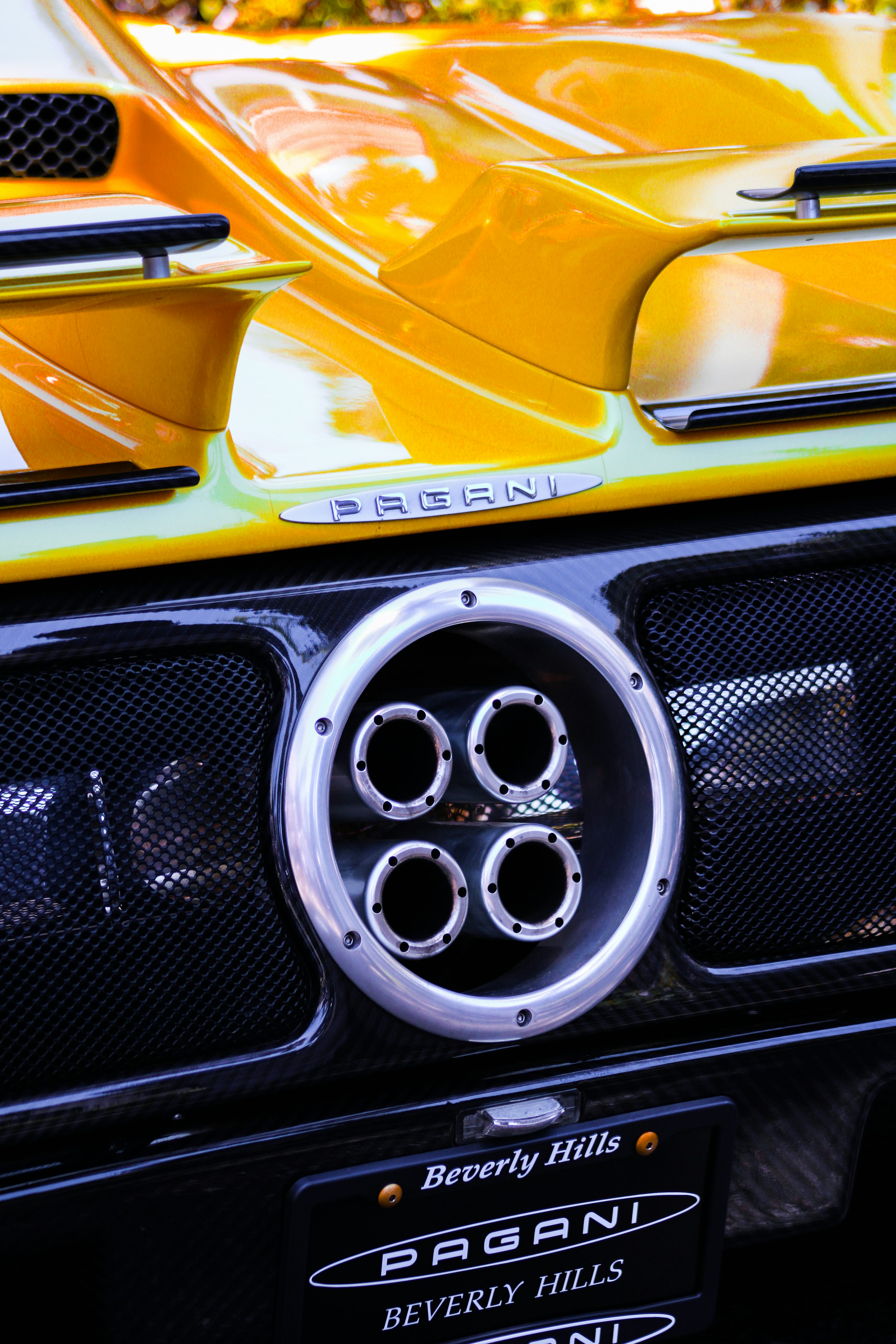 a close up of a yellow sports car