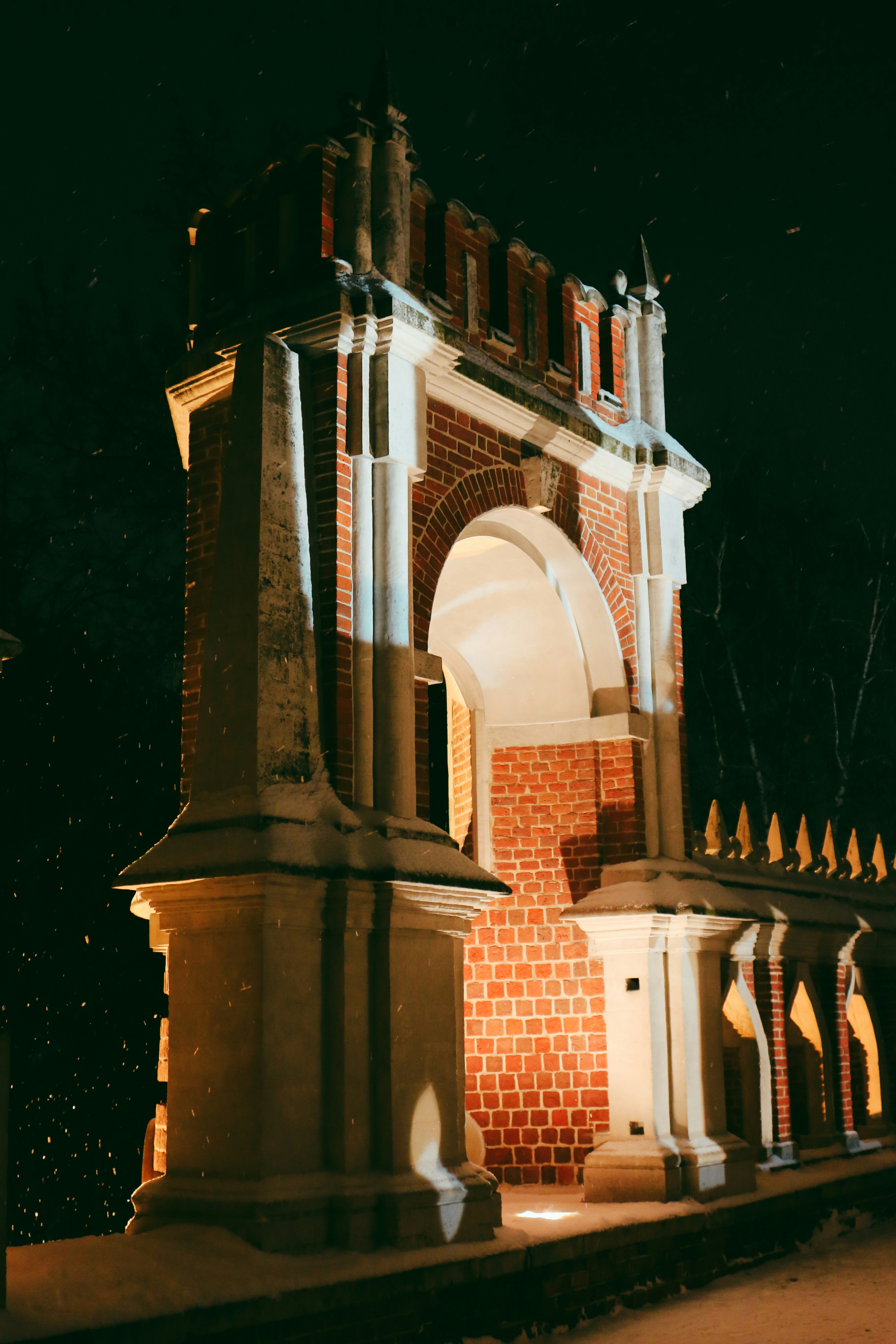 A clock tower lit up at night time photo Free Building Image on Unsplash